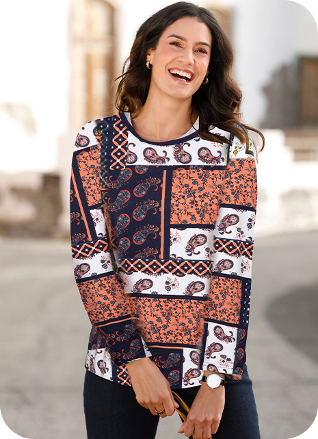 Woman wearing a patchwork print top style.