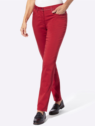 Woman wearing rivet detail pants.