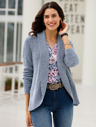 Woman wearing a shawl collar cardigan.