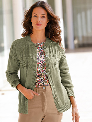 Woman wearing a Cable Knit Button Up Sweater.