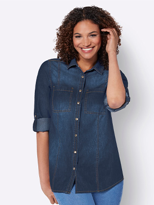 Woman wearing a denim button up blouse.