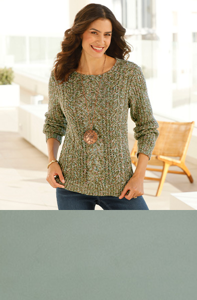 Reed colored mottled cable knit sweater.